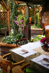 Garden restaurant with setting tables