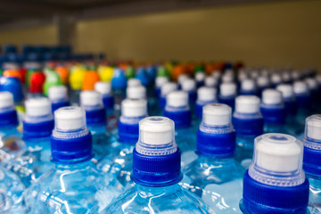 plastic bottles with water, caps, drinks