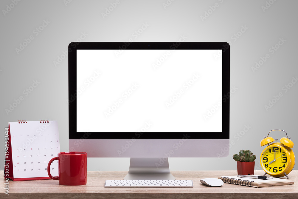 Poster modern desktop computer, coffee cup, alarm clock, notebook and calendar on wooden table. studio shot