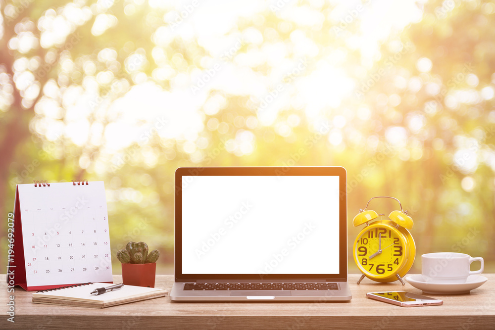 Poster modern laptop computer, coffee cup, alarm clock, notebook and calendar on wooden table and abstract 