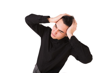 Young man have terrible headache isolated over white background. Frustrated guy touching his head with hands
