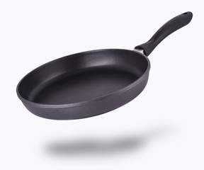 Frying pan isolated over white background.