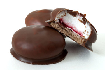 Sweet confectionery and marshmallow sweet delights concept with marshmallows coated in milk...