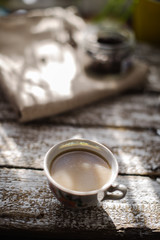 A cup of coffee in the morning sun.