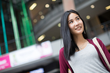 Summer sunny lifestyle fashion portrait of young stylish hipster woman walking on the street, wearing cute trendy outfit