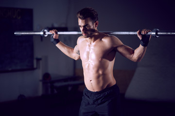 Fototapeta na wymiar male crossfitter workout at fitness club