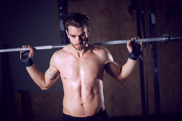 Fototapeta na wymiar male crossfitter workout at fitness club