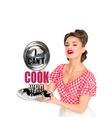 beautiful young woman in retro clothing with I CAN`T COOK, WHO CARES? lettering on serving tray in...