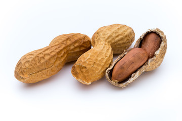 Dried peanuts on the white background.