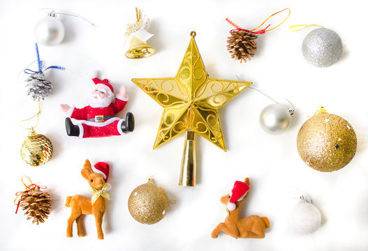 Christmas elements decoration such as toys as a santa, star, golden bell, ball, reindeer, pine cone top view.