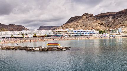 Beach of "Puerto de Mogan" on Grand Canary Island - Spain / Cloudy day at the beach