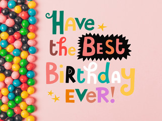 top view of arranged candies isolated on pink