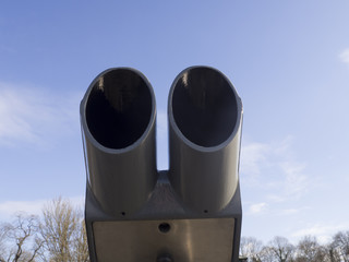 Binoculars. Blue sky.