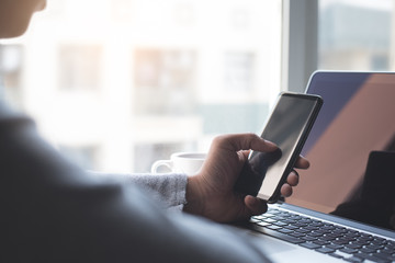 Start up business, businessman using smartphone and laptop computer