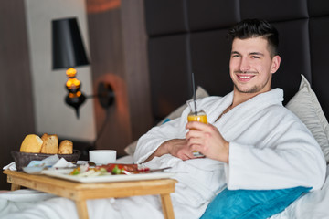 Breakfast in bed, cozy hotel room