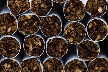 Fototapeta na wymiar Texture of cigarettes. Close-up, tobacco