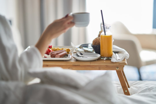 Breakfast in bed, cozy hotel room