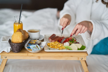 Obraz na płótnie Canvas Breakfast in bed, cozy hotel room