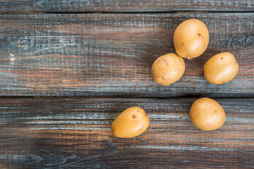 Baby potatoes on a table. Raw potatoes