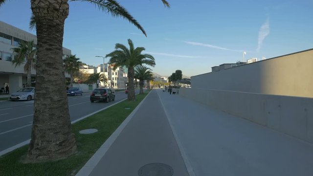 Driving and walking on Obala kneza Branimira street 