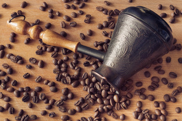 natural, aromatic, not crushed coffee from the tsezh poured on a wooden surface