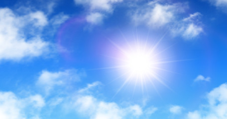Fototapeta na wymiar Sunny background, blue sky with white clouds and sun