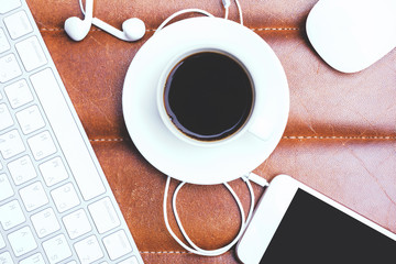 Mobile phone, headphones and coffee