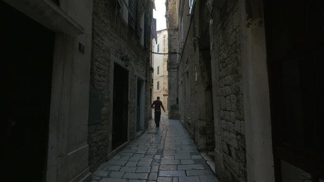 Narrow street with stone buidlings