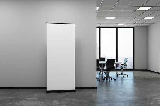 Modern meeting room with blank poster