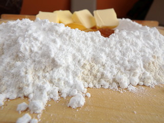 Baking cake ingredients - flour, sugar, eggs, honey, butter and rum
