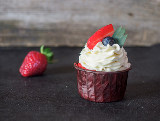 cupcakes with curd cream and strawberries