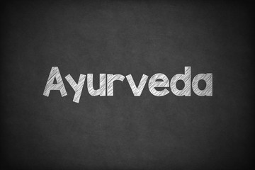 Obraz premium Ayurveda on Textured Blackboard.