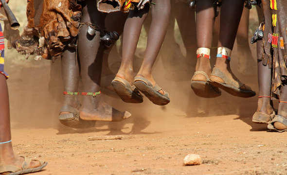 The feet of Hamar women, a primitive tribe, dancing during a bulljump ceremony in the Omo valley in the South of Ethiopia 