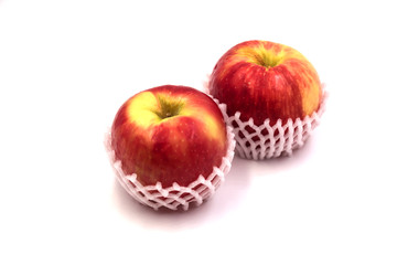 Two apple put in protect form on white blackground.