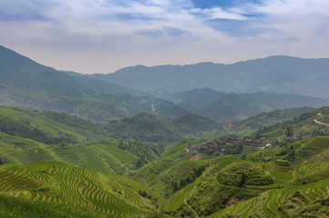 Naklejka na ściany i meble View of the Longsheng Rice Terraces near the of the Dazhai village in the province of Guangxi, in China; Concept for travel in China and beutiful and serene landscape