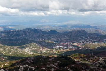 Fototapeta na wymiar mountain view with thick clouds down to the lowland in Montenegro