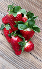 strawberries in the foreground over woods