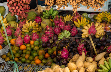 Vivid display of tropical fruits at a market in Khao Lak, Thailand