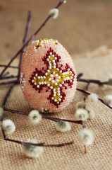 Easter. Beautiful decorative egg and willow twigs