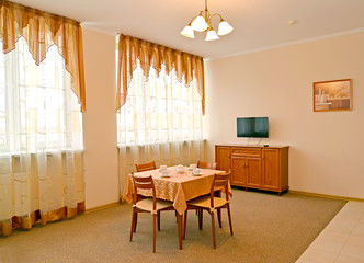  A room interior in warm colors with two windows