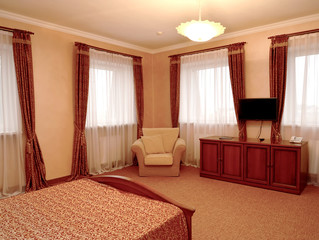 Fragment of an interior of the hotel room in brown tones