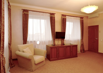 Fragment of an interior of the hotel room in brown tones
