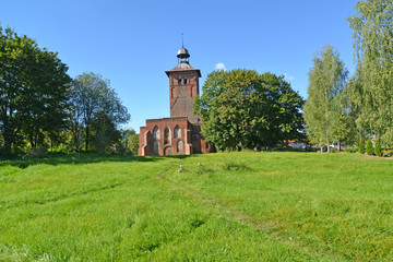 View of Saint Yakov's Lutheran church among trees. Znamensk, Kaliningrad region
