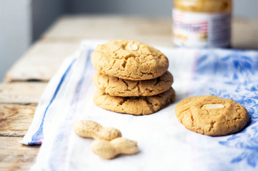 Freshly baked homemade peanut butter cookies on the cotton cloth on the wooden table