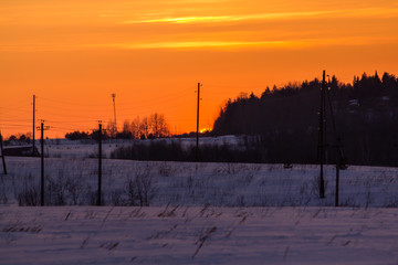 sunset in the winter frosty evening in the Russian outback