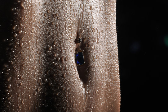 Bodyscape of a Nude wet belly