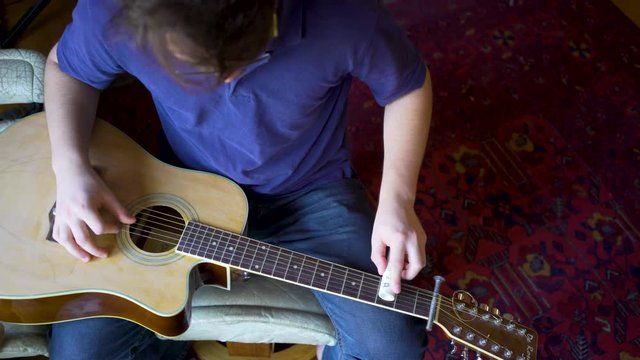 Looking straight down on a beater slide guitar with pvc sider.