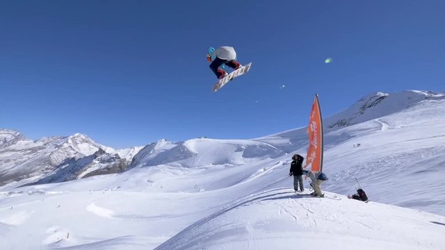 Pro snowboarder Seb Toutant performs a backside triple cab