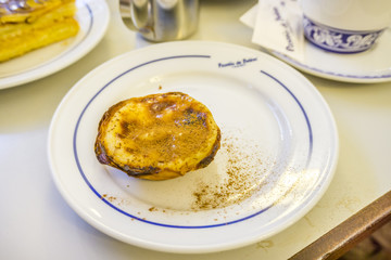 Traditional portuguese pastry and coffee in famous Pasteis de Belem, Lisbon.
