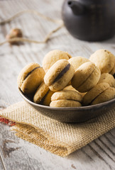 Baci di dama: delicious chocolate cookies with hazelnuts and topping